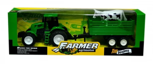 Traktor utánfutóval és tehénnel